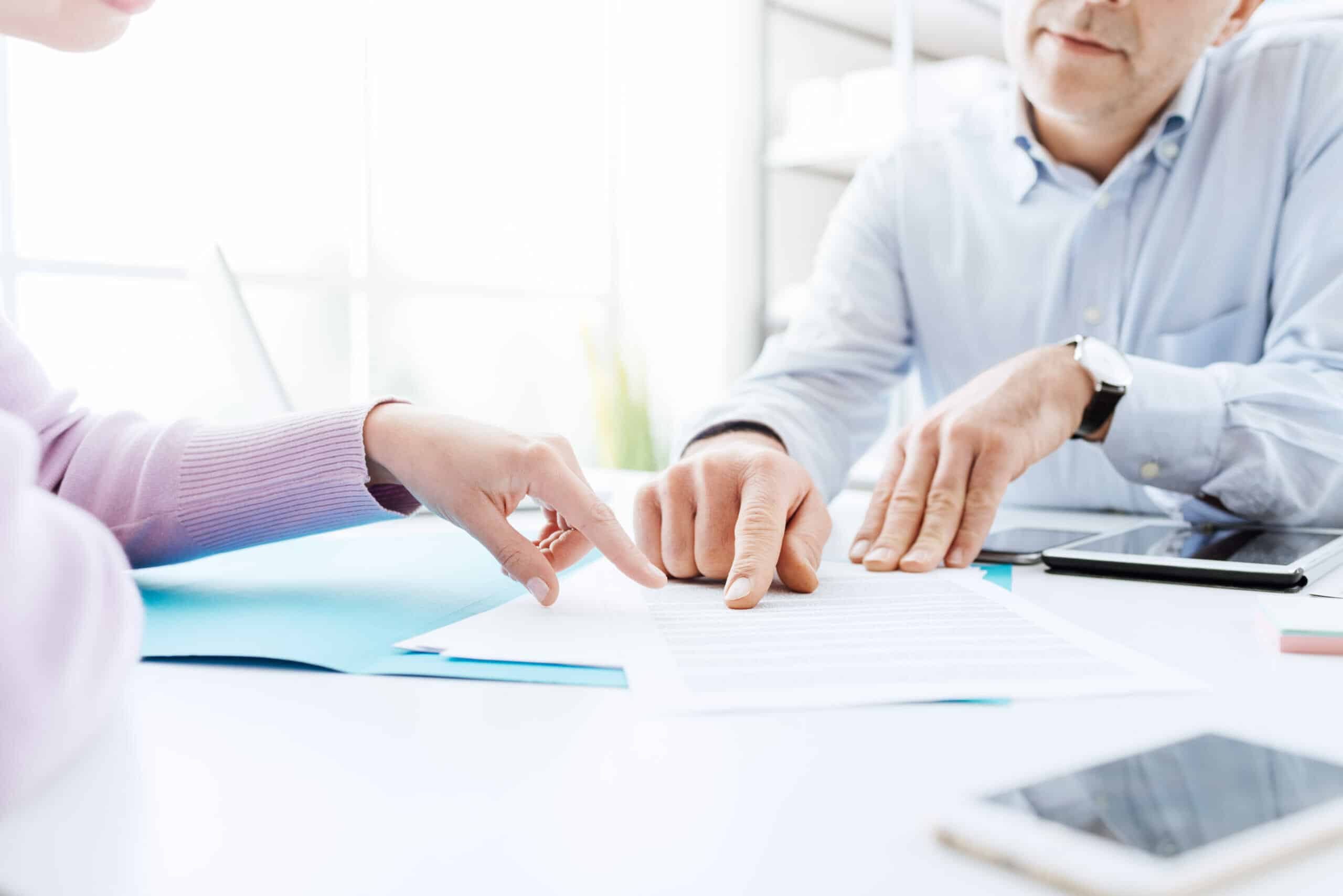 Photo of two solicitors going through documents