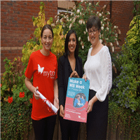 Photo of a member from the Myton Hospice and two Alsters Kelley Solicitors holding a Make A Will Week campaign poster