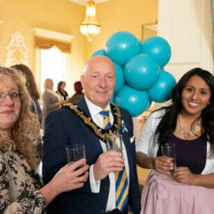 Image of three attendees at the Bonell and Co event in Stratford’s Town Hall