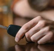 Man's hand holding car keys