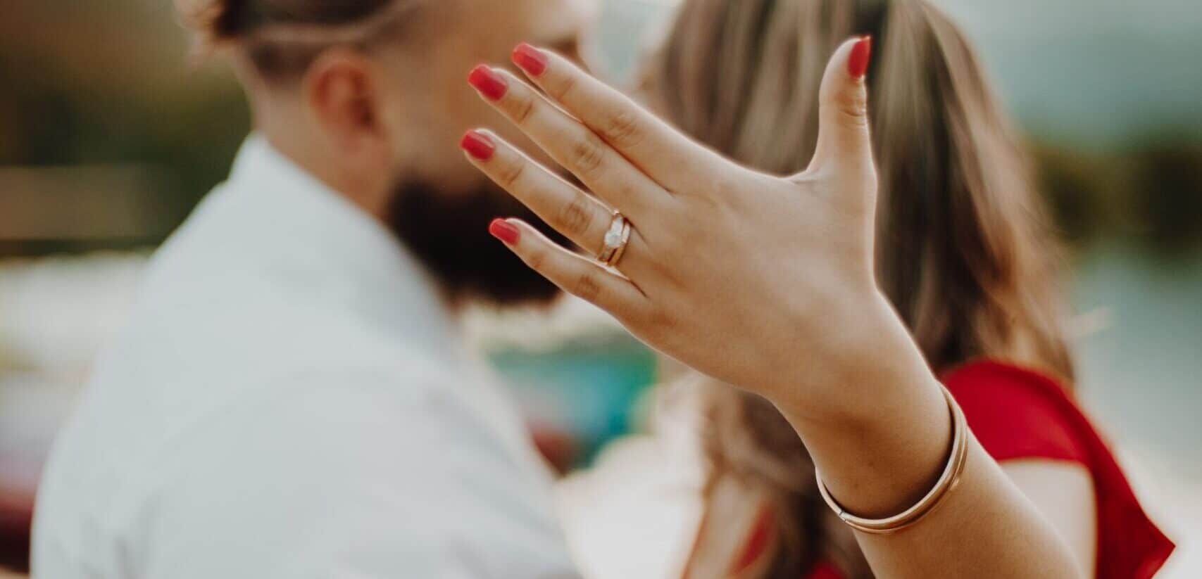 Couple showing proposal and engagement ring Pre-Nuptial Agreements