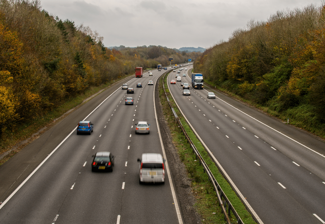 Busy multi-lane motorway with cars and trucks