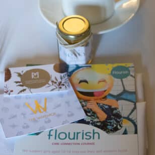 Flourish networking lunch event with tea, honey, and brochures.