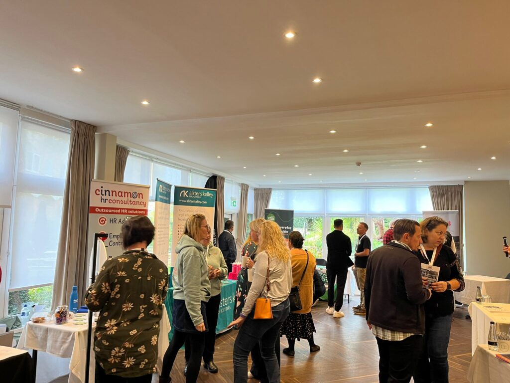 Attendees at the Banbury Chamber of Commerce Expo, engaging in discussions with exhibitors