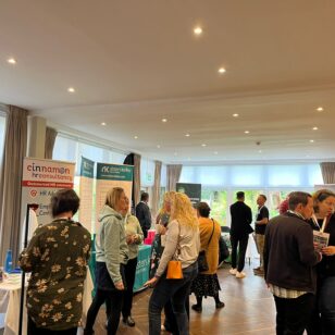 Attendees at the Banbury Chamber of Commerce Expo, engaging in discussions with exhibitors