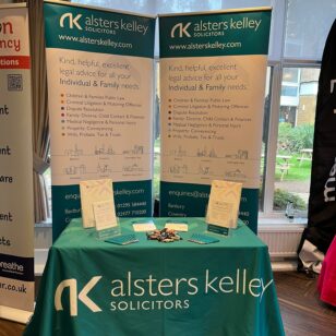 Alsters Kelley Solicitors booth at Banbury Chamber of Commerce Expo with banners and brochures