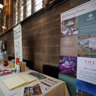 Event venue setup with brochures, flyers, and banners for Ladies First Networking