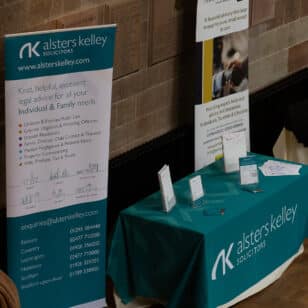 Alsters Kelley solicitors table with brochures at Ladies First Networking event