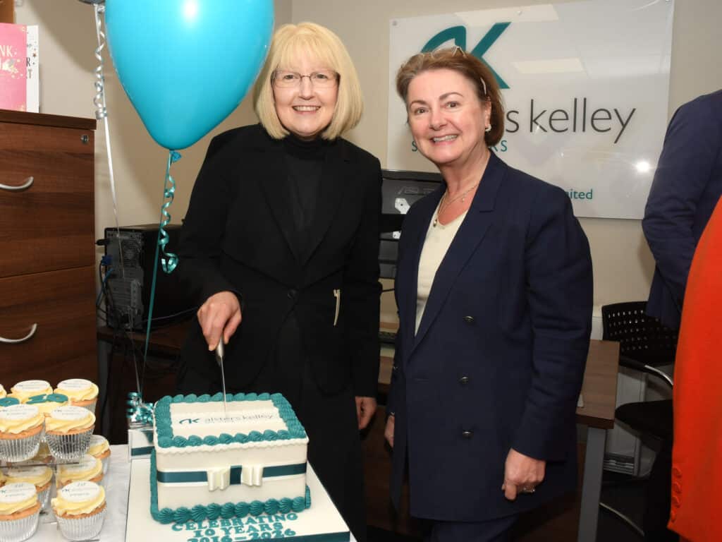 Cath and Julie cutting cake