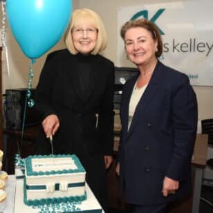 Cath and Julie cutting cake