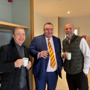 Three men at Banbury Chamber of Commerce roundtable event holding cups