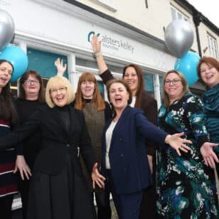 Southam anniversary - group shot - hands in air