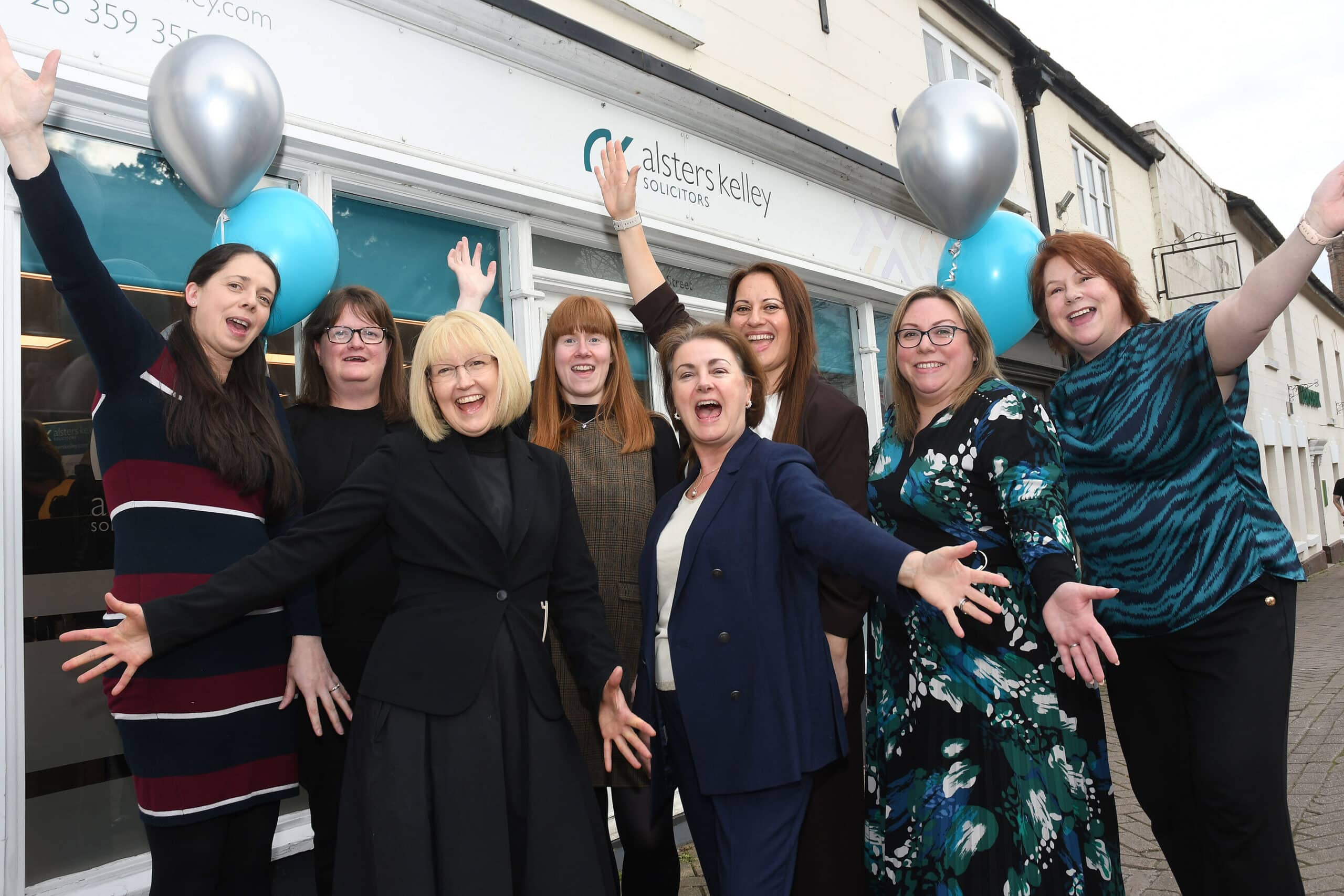 Southam anniversary - group shot - hands in air