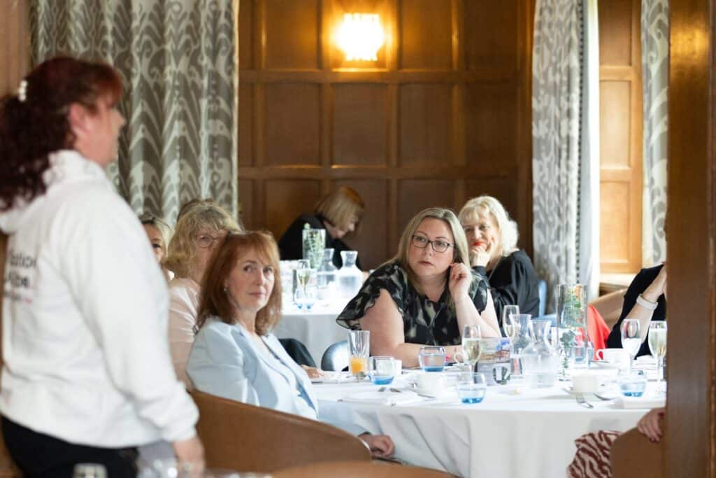 Women at the Ladies First Lunch in June 2026, seated at a table.